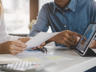 business meeting looking at data and discussing