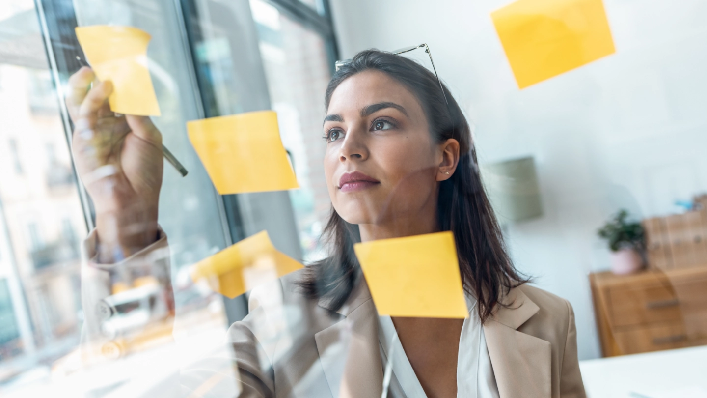 elegant woman planning through sticky notes planning through sticky notes