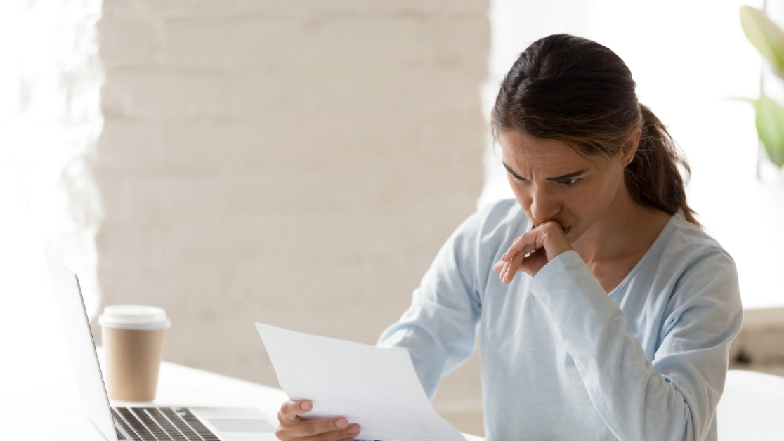 Woman looking at letter