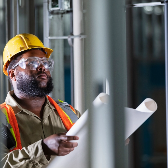 construction worker reviewing drawings